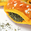 Open Juananip pocket in Doggijuana Pretzel Toy, showcasing fresh, calming Juananip to keep dogs entertained and relaxed.